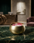Fragnam Mini Brass Aura Candle with intricate design and warm glow, showcasing a small decorative brass candle holder.