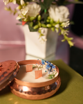 Fragnam Brass Glow Nest Candle with a warm, glowing light inside a decorative brass nest holder.