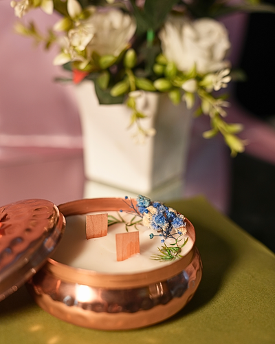 Fragnam Brass Glow Nest Candle with a warm, glowing light inside a decorative brass nest holder.
