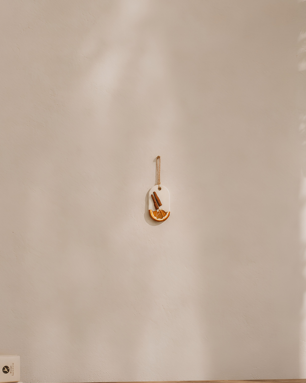 Fragnam Lemon Bark Hanging air freshener with lemon scent, featuring a decorative bark design and hanging string.
