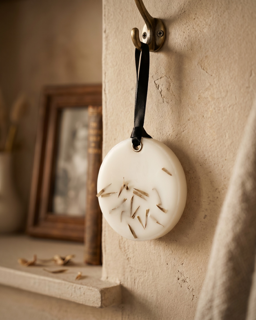 Fragnam Soft Round Hanging ornament with smooth, pastel-colored surface and decorative hanging string for home decor.