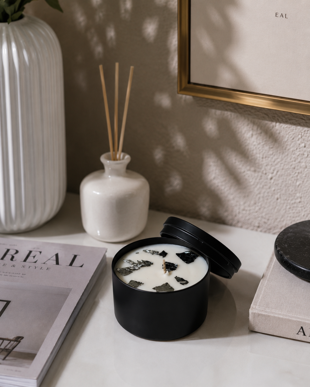 Fragnam MadBlack Flake Candle with black and silver flakes in a glass holder, showcasing a stylish and decorative candle design.