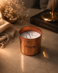 Fragnam Autumn Ember candle with warm, cozy glow and autumn-inspired scent in a glass container.