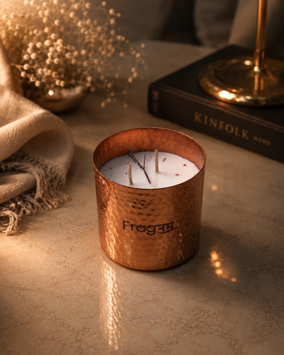 Fragnam Autumn Ember candle with warm, cozy glow and autumn-inspired scent in a glass container.