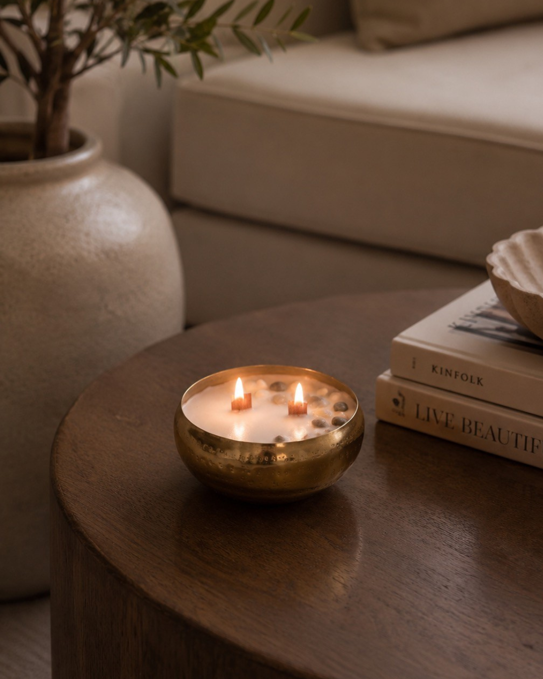 Fragnam Swarna Aura Candle with intricate gold and yellow design, elegant shape, and soft glow, perfect for ambient decoration.