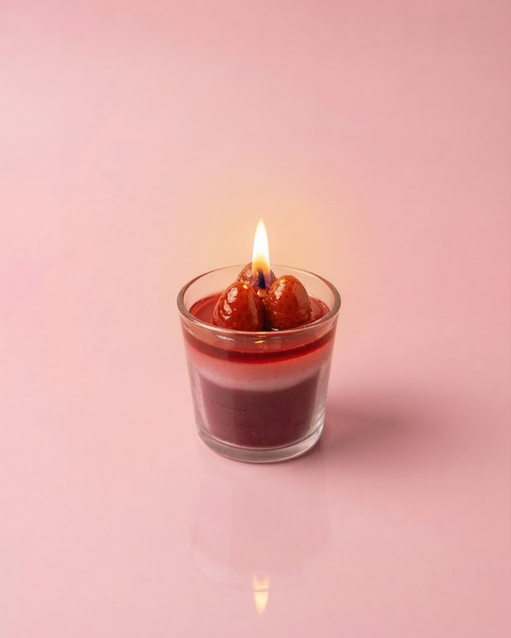 Fragnam Strawberry Charm Candle with pink wax and decorative strawberry charm, ideal for home decor or gifting.