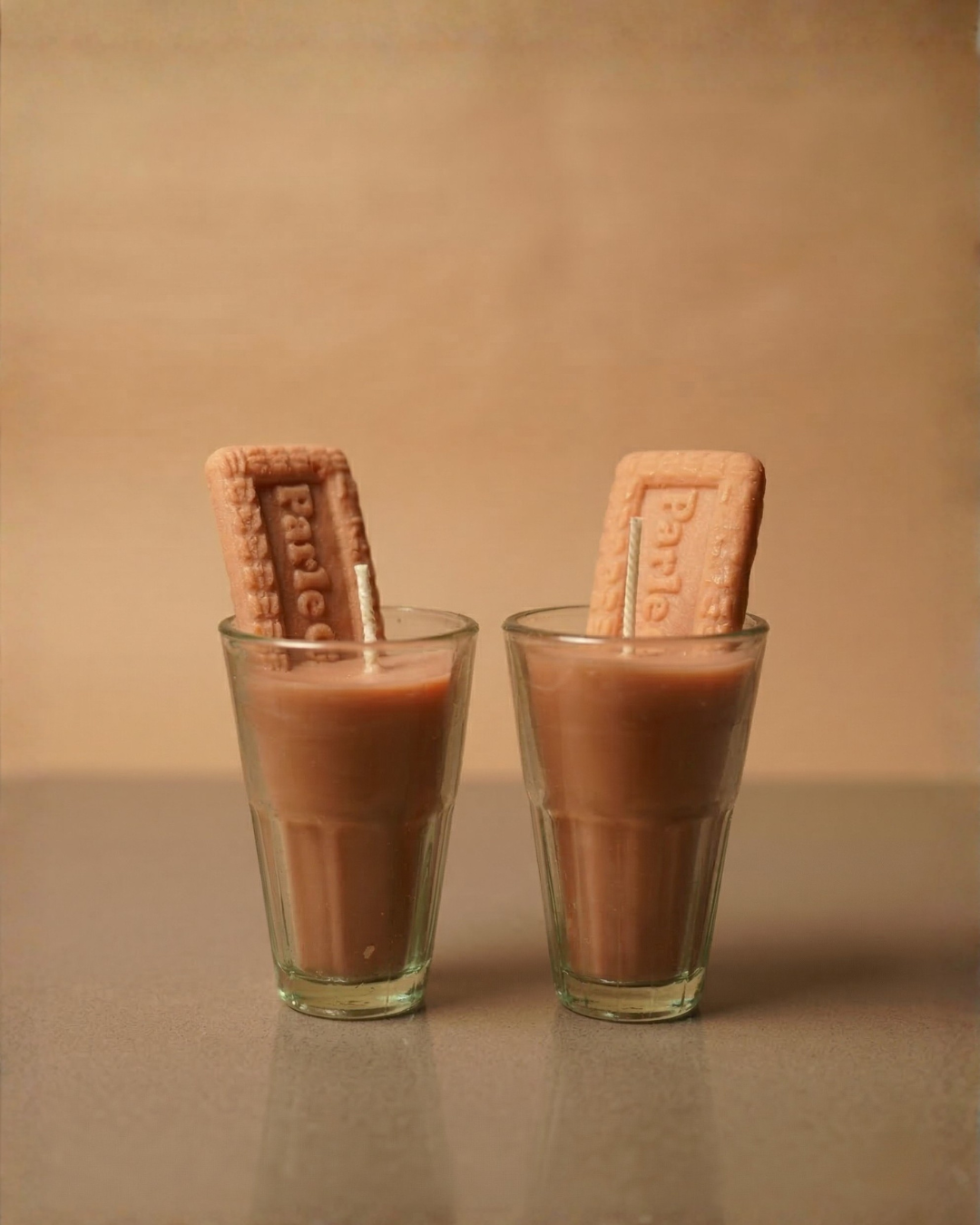 Fragnam Chai Biscuit Candle with warm beige wax and floral design, perfect for cozy home decor and aromatic ambiance.