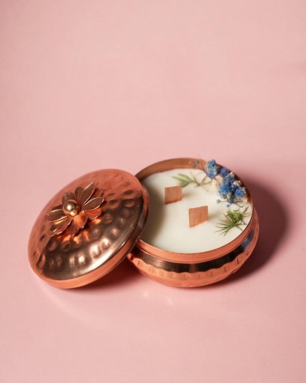 Fragnam Brass Glow Nest Candle with warm flickering flame and decorative brass holder, creating a cozy ambiance.