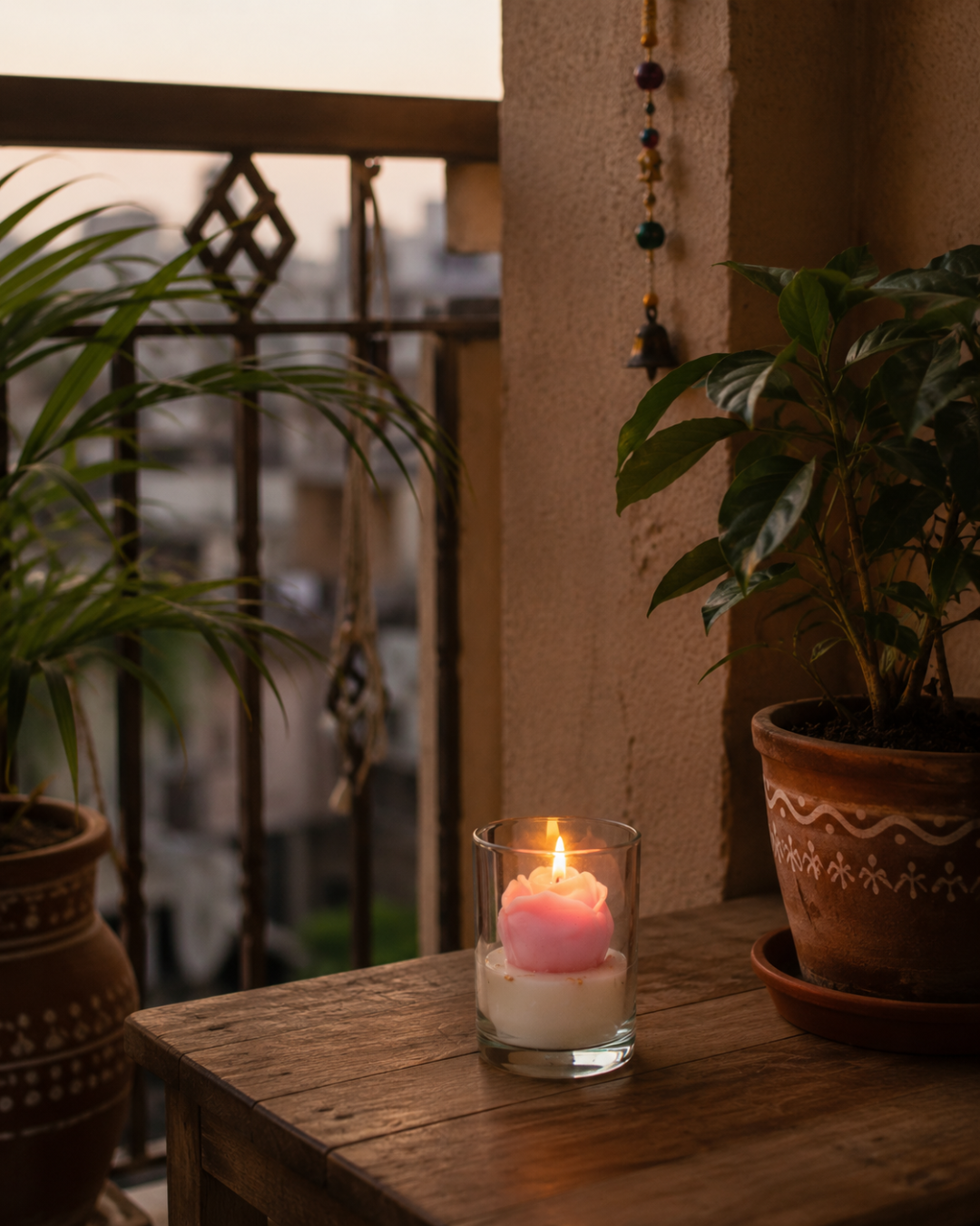 Fragnam Dreamy Rose Candle with soft pink wax and floral rose scent, set in a clear glass holder, ideal for relaxing ambiance.